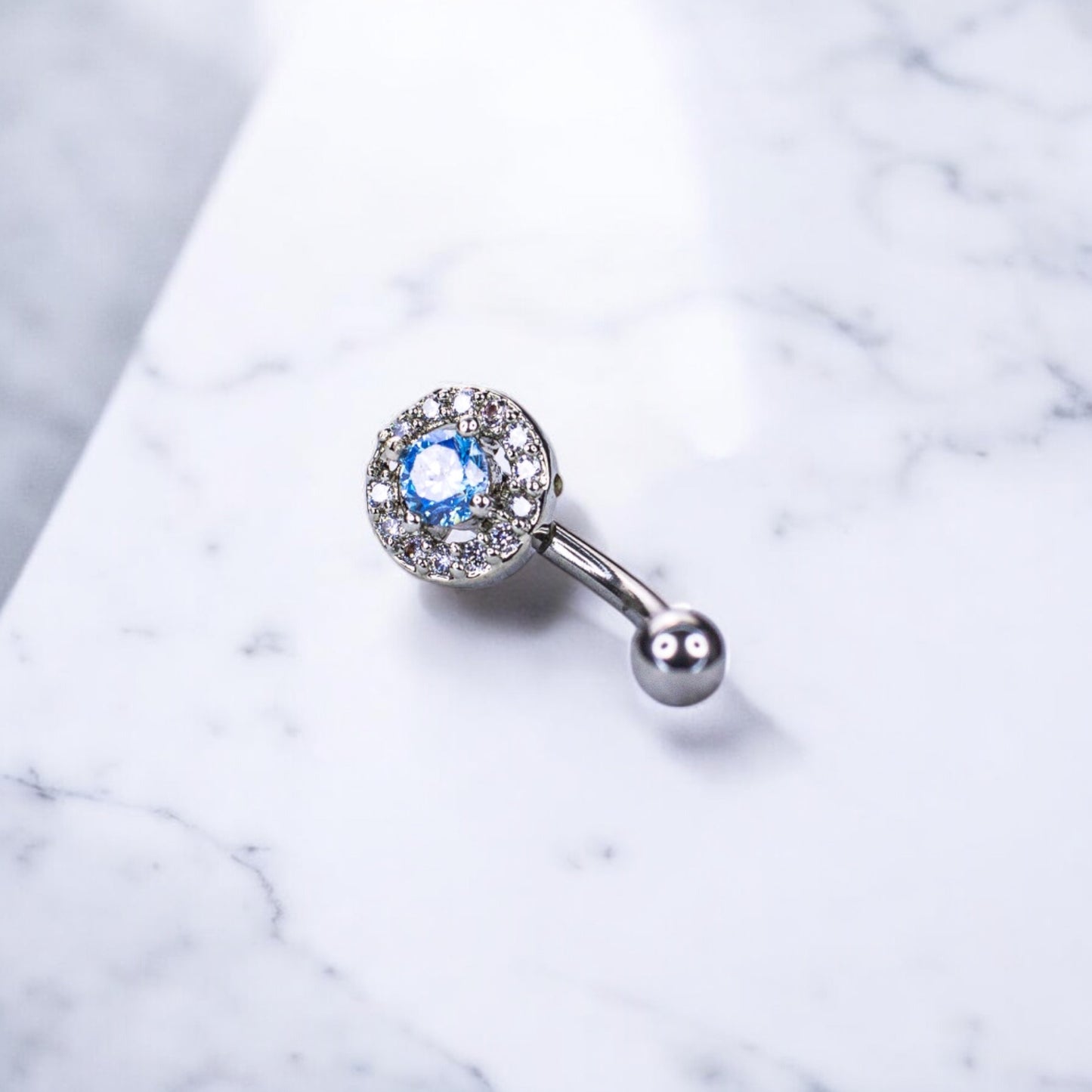 Light Blue CZ with Clear CZ Halo Eyebrow Curved Barbell