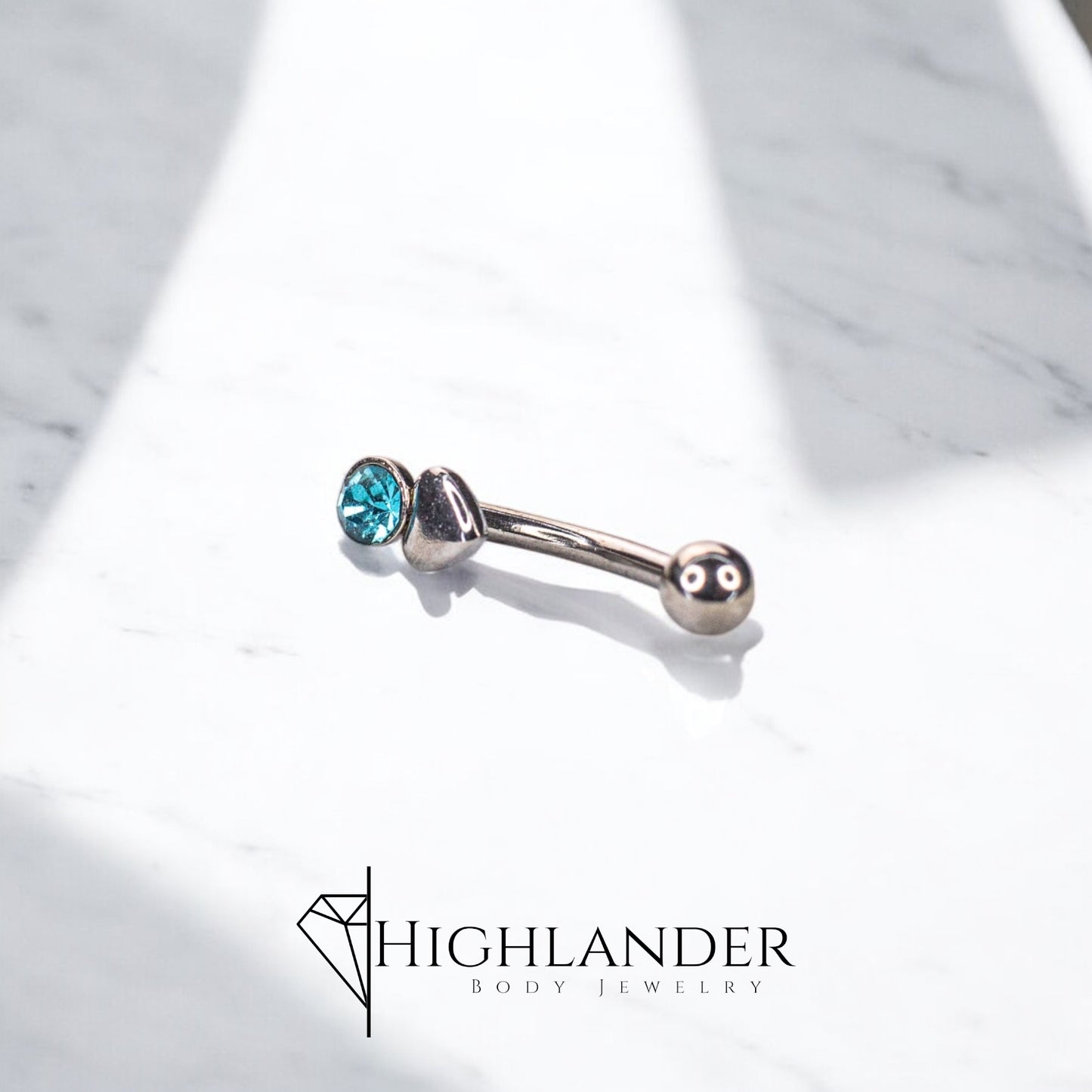 Aqua CZ on Heart Eyebrow Curved Barbell