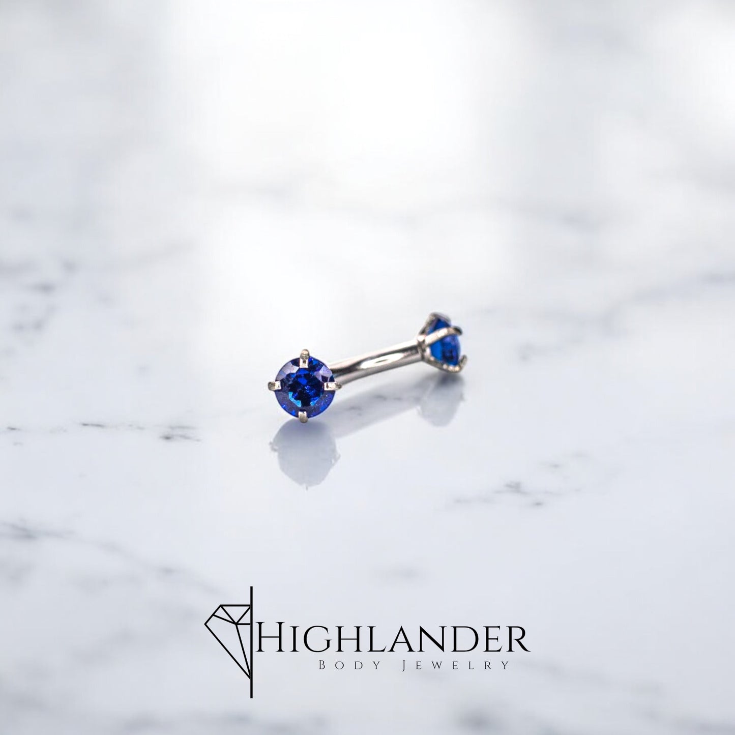 Double Prong Set Sapphire Blue CZ Eyebrow Curved Barbell