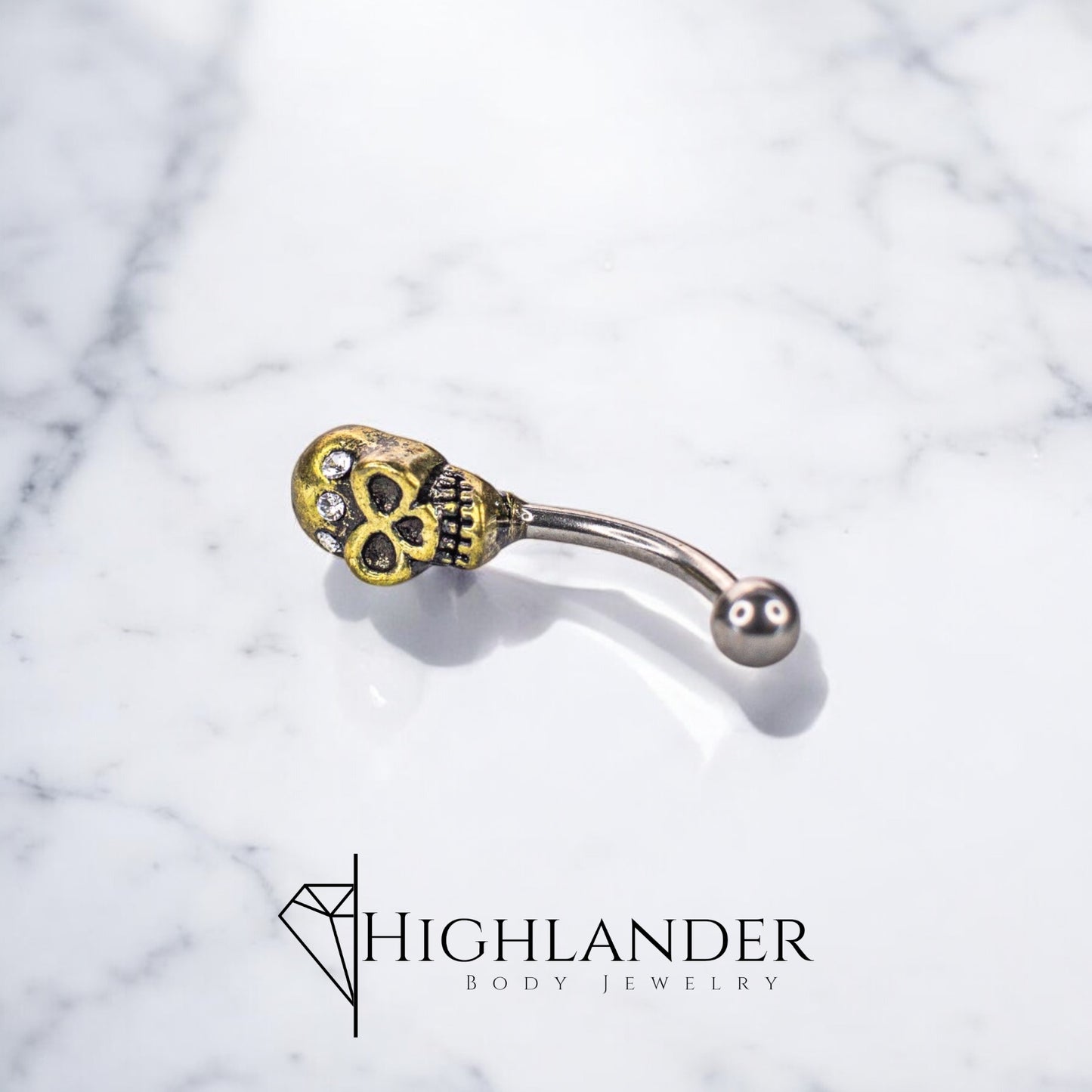 Antique Gold Skull with Clear CZ Eyebrow Curved Barbell