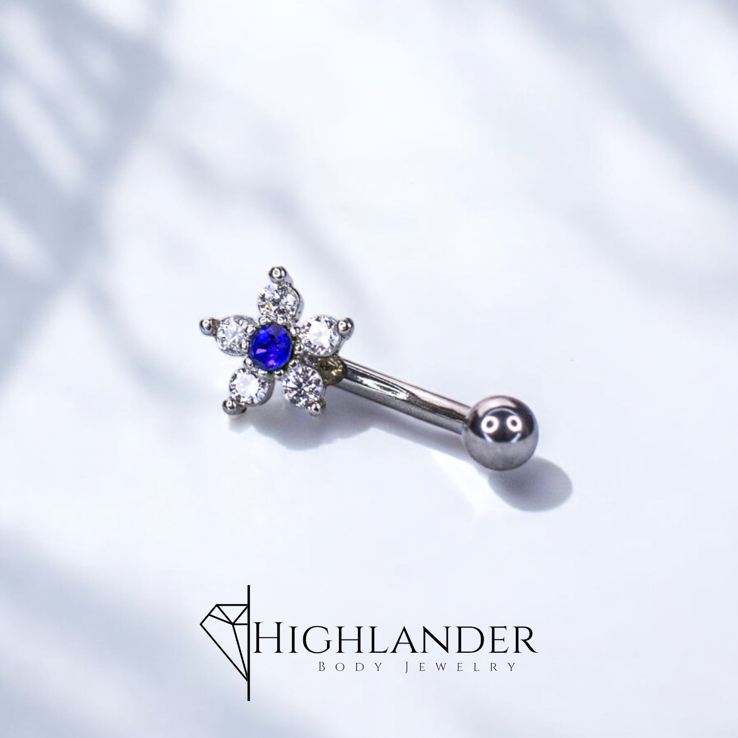 Clear CZ Flower with Blue CZ Center Eyebrow Curved Barbell