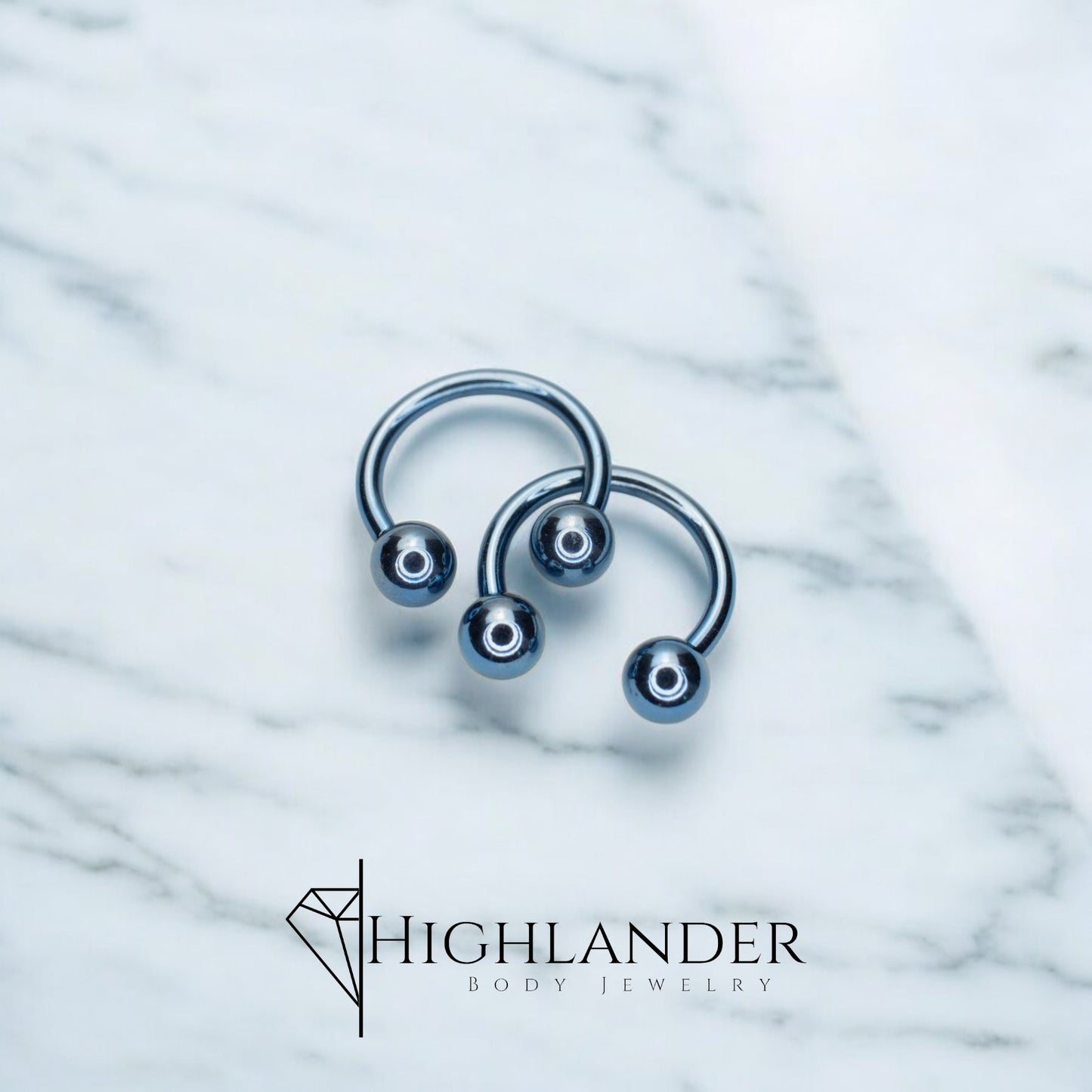 Titanium IP Light Blue Ball Horseshoe Nipple Piercing